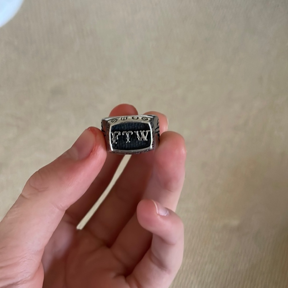 FTW ring with two skeleton middle fingers on sides